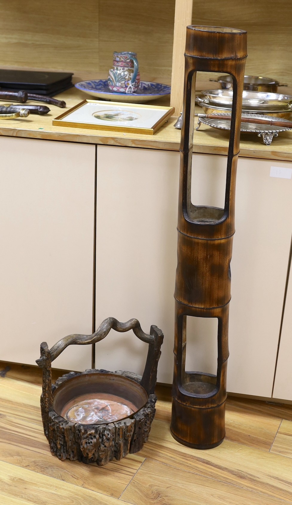 A Japanese Ikebana wood basket, together with a tall bamboo sectional Ikebana vase. Tallest 102cm